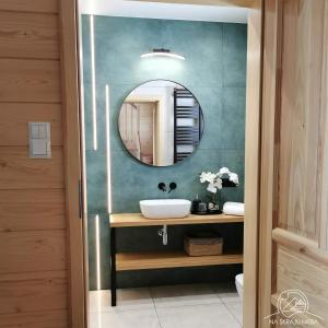 a bathroom with a sink and a mirror at Na Skraju Nieba in Smerek