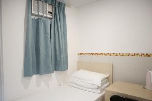 Posteľ alebo postele v izbe v ubytovaní Hoi To Hostel