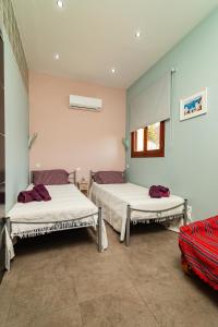 a room with two beds and a window at Villa Chloe with the best sunset in Myrties
