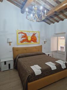 Postel nebo postele na pokoji v ubytování Borgo Pio 182 Vatican Suite