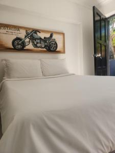 a picture of a motorcycle on top of a bed at Casa Palmeira in Nelspruit