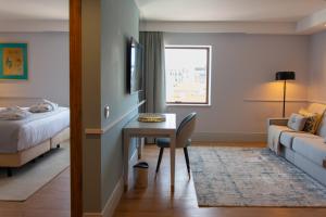 VIP Executive Suites do Marquês Hotel客房内的一张或多张床位