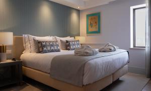 VIP Executive Suites do Marquês Hotel客房内的一张或多张床位
