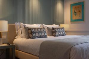 VIP Executive Suites do Marquês Hotel客房内的一张或多张床位