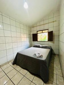 Un pat sau paturi într-o cameră la Casa Mandacaru Espaço completo