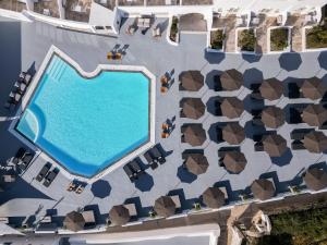 an overhead view of a swimming pool at a resort at Santorini Palace in Fira