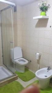 a bathroom with a toilet and a sink and a shower at Beautiful apartment in the city center in Casablanca
