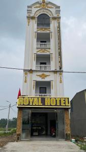 a hotel building with a tower with a royal hotel sign at Royal Hotel Vĩnh Phúc in Vĩnh Phúc