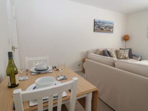 a living room with a couch and a table at 16 Church Street in Lyme Regis