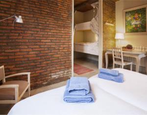 two towels sitting on a table in a room at Apartamento Azul in Revilla de Cepeda