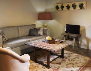 a living room with a couch and a coffee table at Apartamento Coral in Revilla de Cepeda