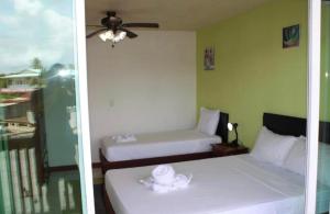 Кровать или кровати в номере Los Balcones de Carenero