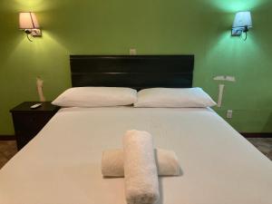Een bed of bedden in een kamer bij Los Balcones de Carenero