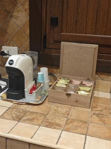 a kitchen counter with a blender and a box of food at CASA MIKY in Palermo