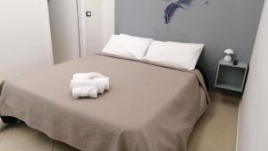 Postel nebo postele na pokoji v ubytování KiMia Home, Centro