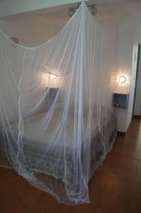 Postel nebo postele na pokoji v ubytování Bas de villa, hauteurs du Robert + 9 fotografií