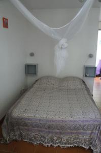 Postel nebo postele na pokoji v ubytování Bas de villa, hauteurs du Robert