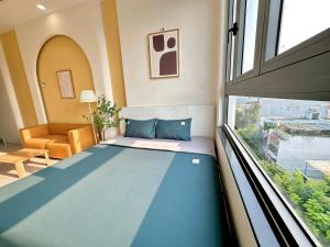 Postel nebo postele na pokoji v ubytování Corgi House Danang