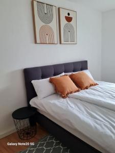 a bed with two pillows on it in a bedroom at Lilias Ruheoase in Pfungstadt