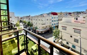 a view of a city from a balcony at Sary's Hotel in M'diq