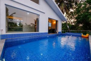 Πισίνα στο ή κοντά στο Eden Villas by Incred Stays 4 BHK Pvt Pool Villa, Calangute, North Goa