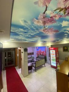 a room with a painting of flowers on the ceiling at İHVA HOTEL PİERRELOTİ in Istanbul