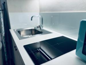a kitchen counter with a sink in a kitchen at Appartamento - Angolo di Rio in Riomaggiore