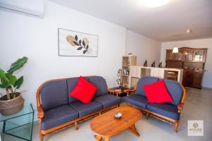 a living room with two chairs and a table at Herminia in La Herradura