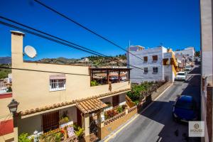a view of a street from a building at Herminia in La Herradura