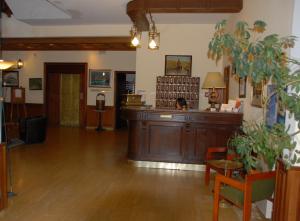 a lobby with a large wooden desk in a room at Castellu Rossu in Lucciana +37 photos