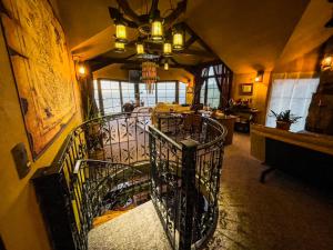 a room with a spiral staircase in a building at Homestay at "Explore Cafe & Lodge" with stunning ocean view in Chiloe Island, Patagonia in Duhatao