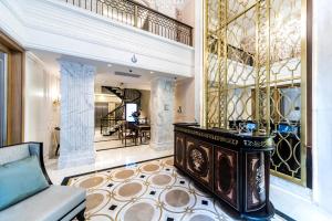 a living room with a couch and a table at Arcade Hotel & SPA Nisantasi in Istanbul