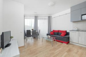 Televízia a/alebo spoločenská miestnosť v ubytovaní Apartamenty Horyzont SeaView by Rent like home