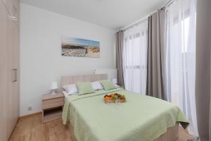 Posteľ alebo postele v izbe v ubytovaní Apartamenty Horyzont SeaView by Rent like home