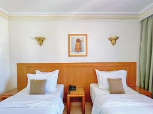 Majliss Hotel Downtown客房内的一张或多张床位