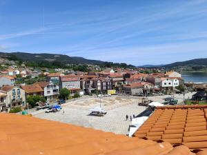 a view of a town with a body of water at Ático Pequeño Paraíso Combarro in Combarro +48 photos