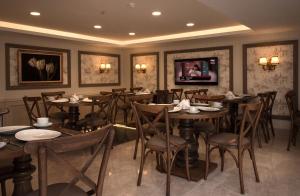 a restaurant with tables and chairs in a room at Istanbul Town Hotel in Istanbul