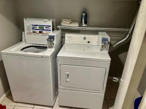 a washer and dryer in a small room at Close to Downtown - Free Parking in Chicago