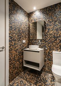 a bathroom with a sink and a toilet at Alojamientos Turísticos con terraza en Santander LaPera in Santander +75 photos