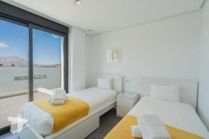 Postel nebo postele na pokoji v ubytování CostaBlancaDreams Villa Strelitzia in Javea