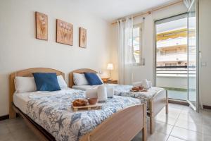 Posteľ alebo postele v izbe v ubytovaní Bahía II