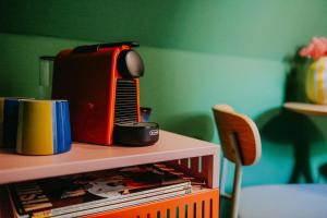 a radio sitting on top of a shelf with books at sleepArt green in Celle