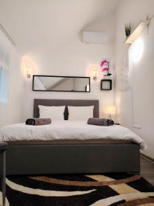 Postel nebo postele na pokoji v ubytování Nyuszis Apartman