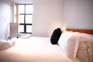 Letto o letti in una camera di The Tourmaline Suite