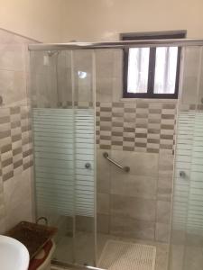 a shower with a glass door in a bathroom at Kallipateira apartments in Rhodes Town