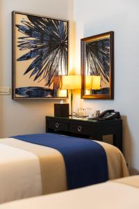 Ein Bett oder Betten in einem Zimmer der Unterkunft Boutique Hotel Stari Grad