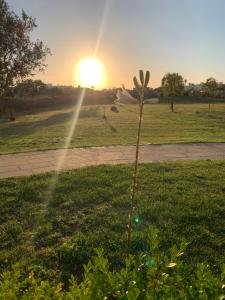 The sunrise or sunset as seen from a vendégházakat or nearby
