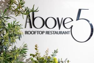 a sign for the adore roof top restaurant with plants at Boutique Hotel Stari Grad in Dubrovnik