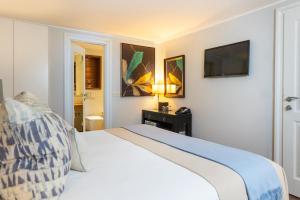 Ein Bett oder Betten in einem Zimmer der Unterkunft Boutique Hotel Stari Grad
