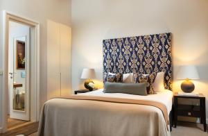 Ein Bett oder Betten in einem Zimmer der Unterkunft Boutique Hotel Stari Grad